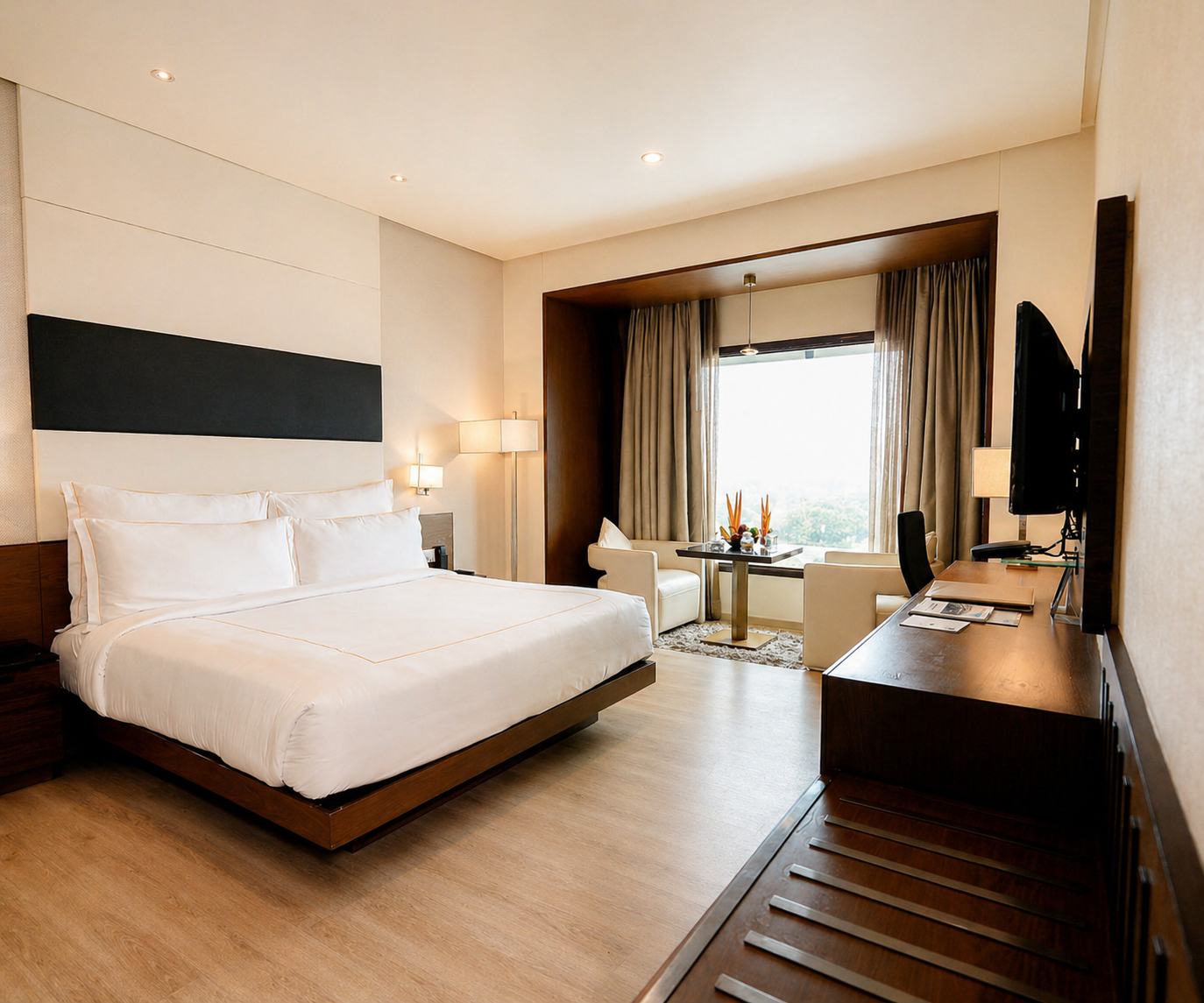 Executive Suite king-size bed and window seating at Narayani Heights